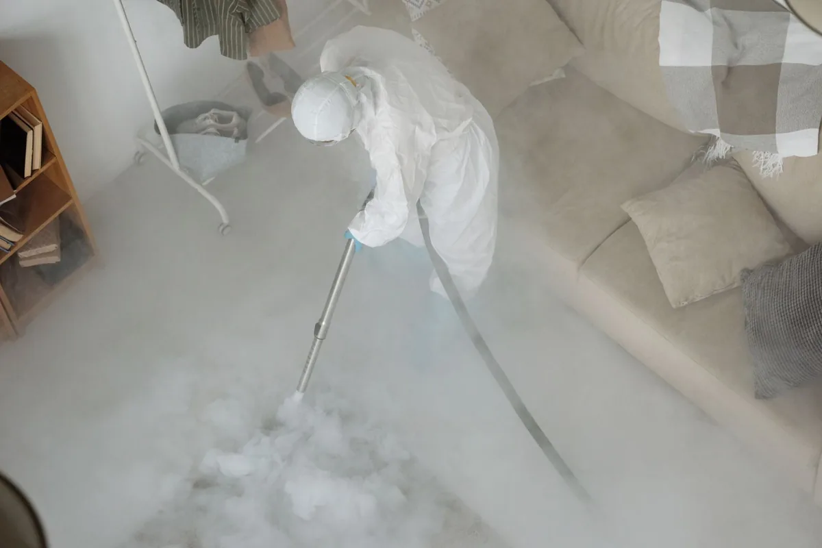 Biohazard cleanup technician in protective equipment, McMechen, WV